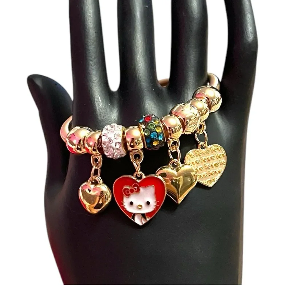 Hello Kitty Hearts White Rhinestone Gold Tone Kids’ Charm Br…